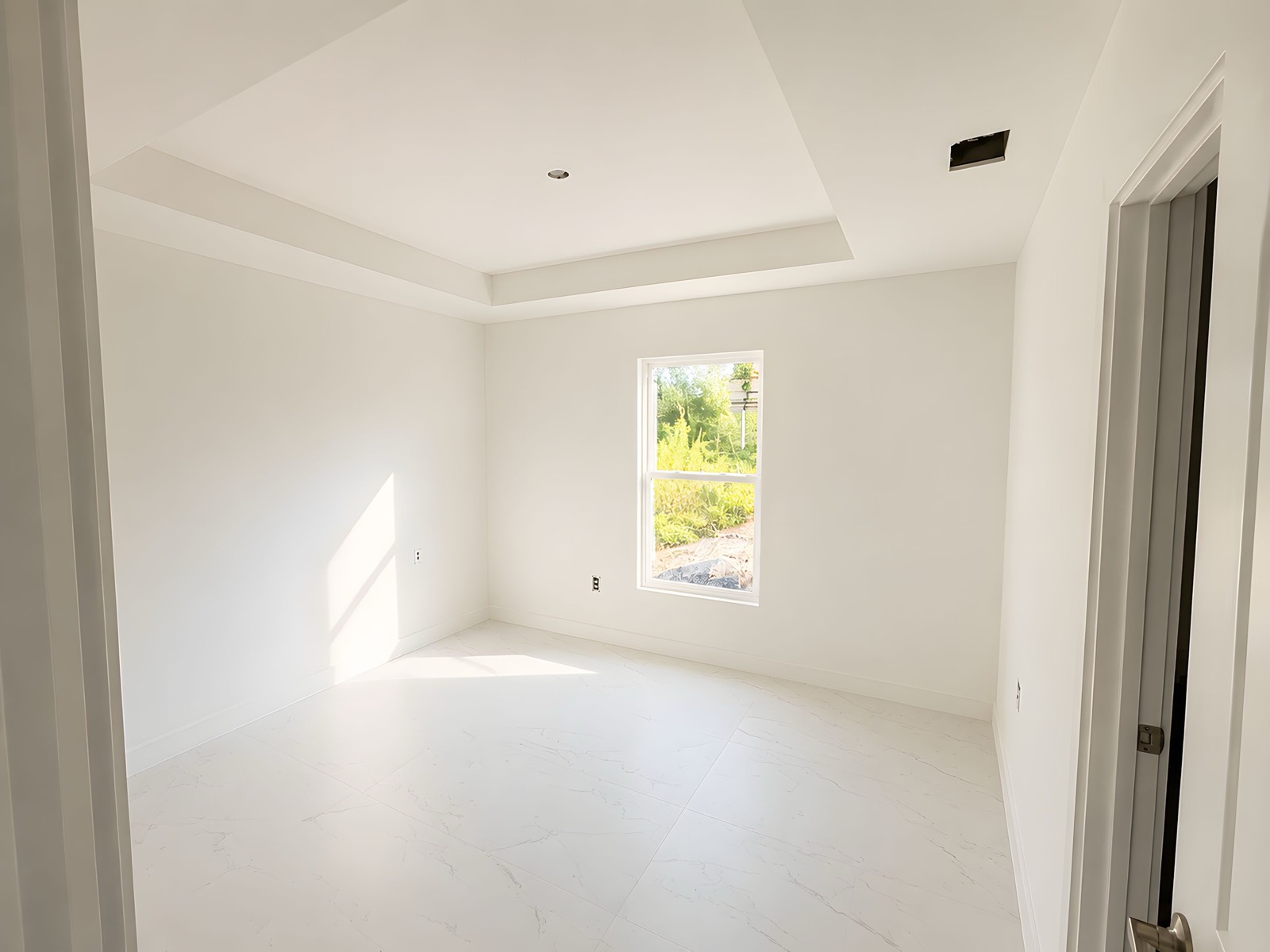 Bedroom of The Egret under construction &mdash; porcelain tile flooring